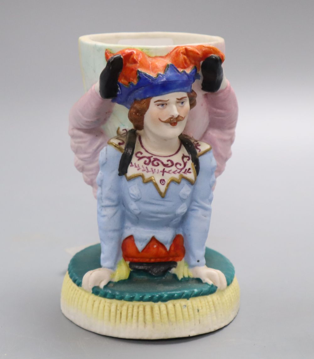 A French coloured biscuit acrobat cup, height 14cm